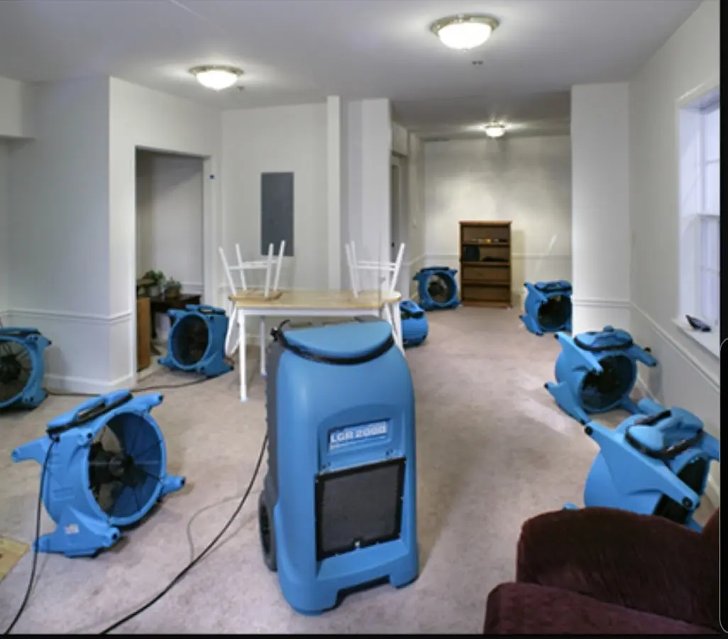 Air movers and dehumidifier setup for Water Damage Restoration in Alice
